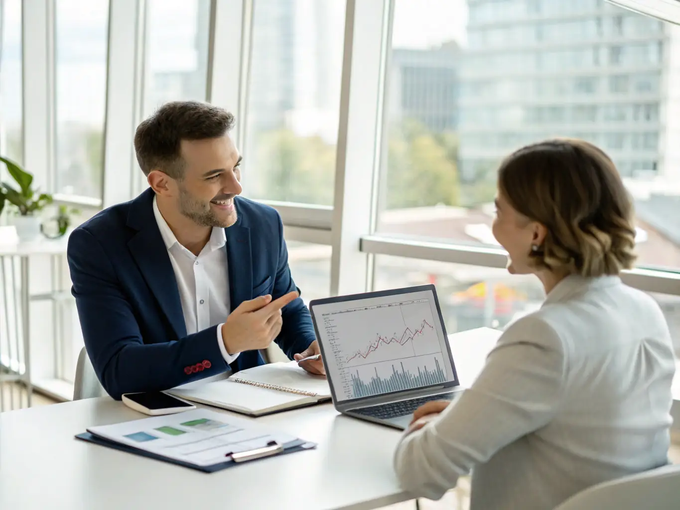 A small business owner reviewing financial statements with a Call For Money Lending Investor Inc. advisor, illustrating business growth and financial planning.